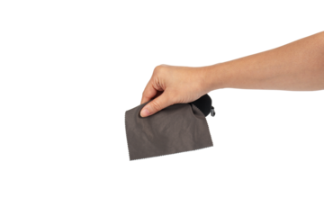 Hand and crumpled microfiber cleaning cloth, isolated on transparent background