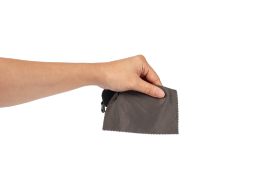 Hand and crumpled microfiber cleaning cloth, isolated on transparent background