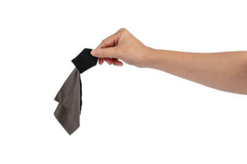 Hand and crumpled microfiber cleaning cloth, isolated on transparent background