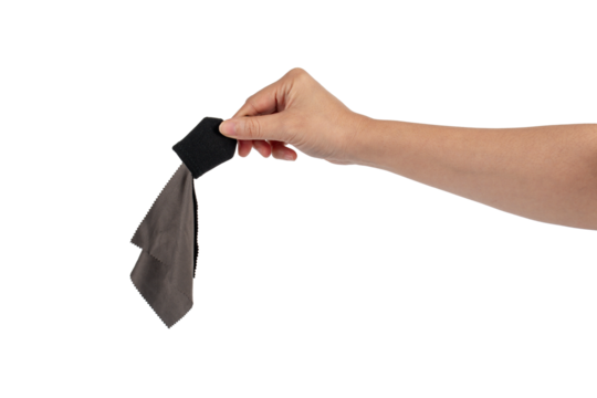 Hand and crumpled microfiber cleaning cloth, isolated on transparent background