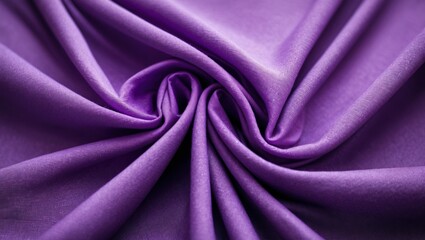 Obraz premium Luxurious close-up of rich purple fabric showcasing elegant folds and smooth texture ideal for fashion or interior design projects