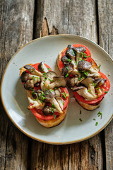 toast with cheese, tomatoes and oyster mushrooms.
