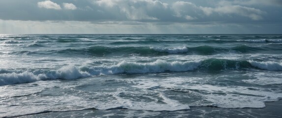 Fototapeta premium Waves crashing on a shoreline under cloudy summer skies with empty space for text, evoking serenity and tranquility by the sea.