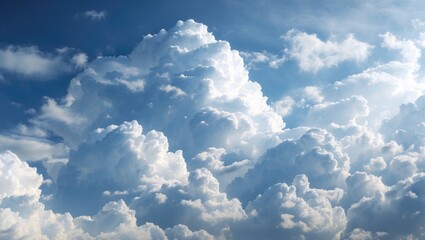 Fluffy white clouds spread across a bright blue sky creating a serene and peaceful natural landscape background.