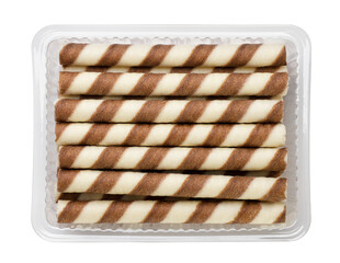 Striped wafer rolls in a package close-up on a white. Top view
