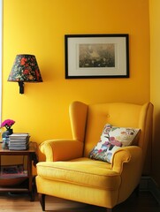 Yellow armchair with art and lamp next to side table