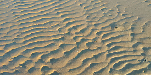 background of beige beach sand with natural pattern