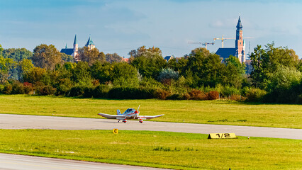 Fototapeta premium Autumn or indian summer view with sports aircraft at Straubing airport, Straubing-Bogen, Bavaria, Germany