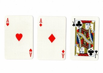 A hand of three playing cards isolated on a white background.