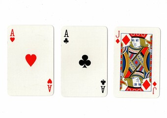 A hand of three playing cards isolated on a white background.