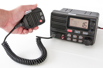 Handheld PTT speaker for trunk radio communication in action during a roadside stop