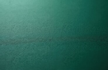 Obraz premium Macro shot of dark green rough paper texture. Craft emerald cardboard structure. Mottled surface for background, wallpaper, design, card, brochure, printing material, canvas, template, mockup.