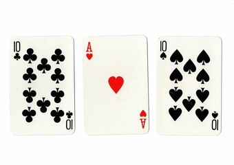 A hand of three playing cards on a white background.