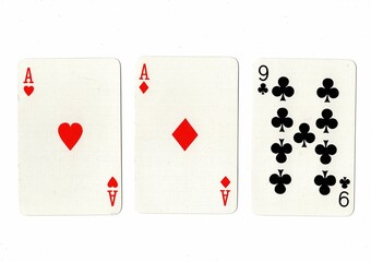 A hand of three playing cards on a white background.
