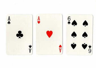 A hand of three playing cards on a white background.