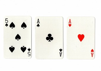 A hand of three playing cards on a white background.