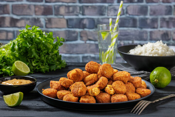 crunchy breaded salmon fish nuggets on plate