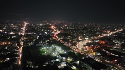 An aerial view of Dehradun, a smart Indian city. The top-angle views of the city's residential houses in Dehradun, Uttarakhand, India. A beautiful city in India at night.