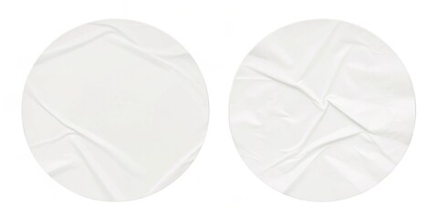 Two white circles with a white background. The circles are torn and have a rough texture. Concept of wear and tear, as if the paper has been used and abused