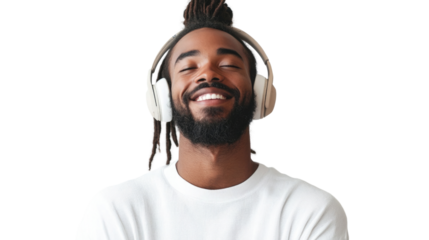 Smiling man enjoys music while wearing headphones indoors, creating a relaxed atmosphere