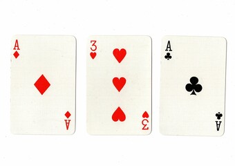 A hand of three playing cards showing a pair on a white background.
