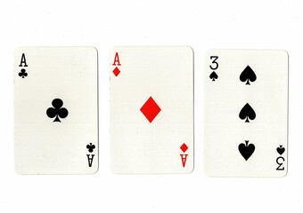 A hand of three playing cards showing a pair on a white background.