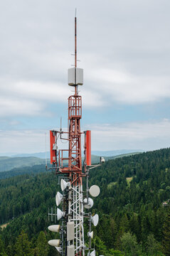 Fototapeta Communication tower overlooking forested hills in Slovakia
