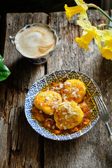 Syrniki with sea buckthorn sauce
