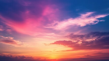 Obraz premium Majestic sunset over a mountain range with rich colors and silhouetted peaks creating a dramatic evening scene