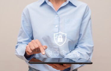 Close up of Businesswoman using tablet and managing cybersecurity and life insurance in futuristic...