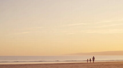 Fototapeta premium Family enjoying an evening walk on the beach, calm and serene atmosphere with golden hour lighting
