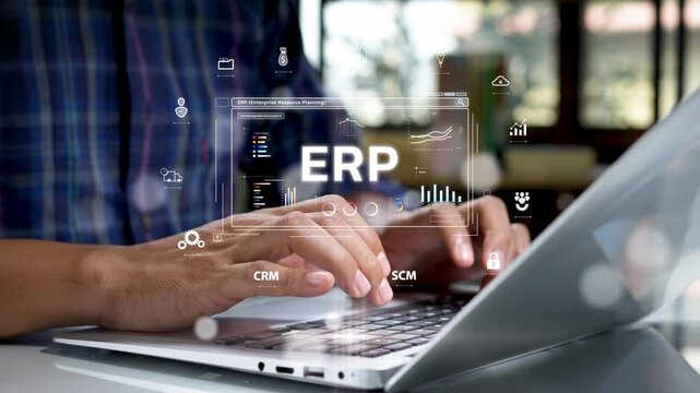 Close-up of hands typing on a laptop keyboard with a futuristic digital interface displaying ERP (Enterprise Resource Planning) system, analytics, and business management icons.