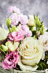Bouquet of beautiful tender flowers - white and pink roses and lisianthus