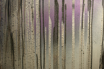 Morning condensation on badly insulated window glas  in the morning.