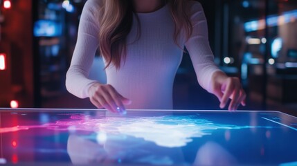 Woman manipulating a holographic map on a transparent table, illuminated by glowing projections in a modern tech room,