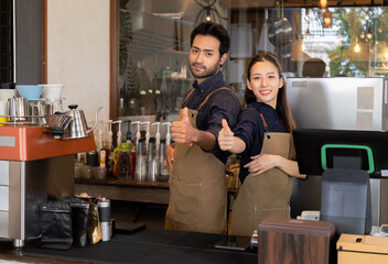 Multiethnic barista couple arm crossed smile looking camera happy start-up cafe small business entrepreneur, young retail business owner working in coffee shop restaurant standing in front of counter