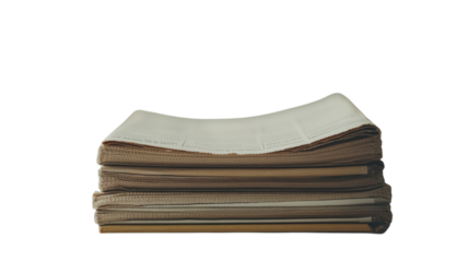 Stack of open book pages with a neutral background showcasing various textures and colors