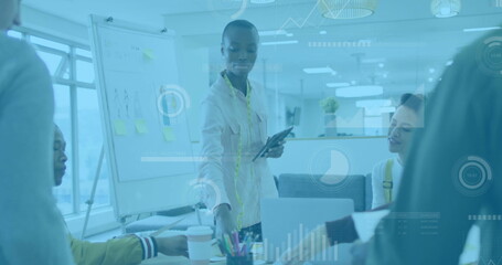 Image of financial data processing over diverse business people in office