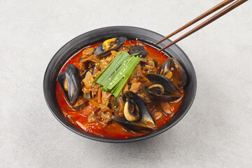 Jjambbong is made by mixing noodles with various seafood or vegetables and pouring broth made from...