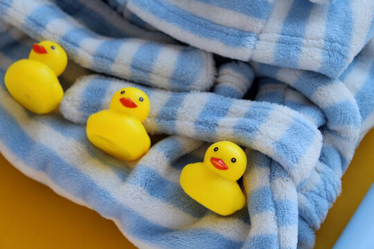 rubber jocks lie on a soft white blue robe