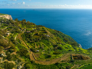 Drone view of famous Dingli cliffs. Mediterranean sea, blue sky. Malta island