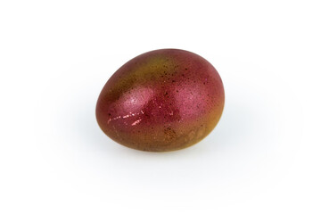 Golden brown easter egg with  glowing shell pattern, isolated on white background. Color contrast, creativity, holiday decoration, creativity, symbolism of rebirth. Copy space. Selective focus
