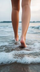 Barefoot walking on a sandy beach, with waves. Therapy and reduce stress in living and investing and doing business.