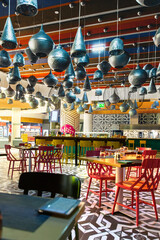 Bright interior with many different lamps of original design in Arabic style