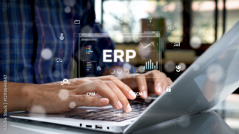 Leinwandbilder close-up of hands typing on a laptop keyboard with a futuristic digital interface displaying erp (en