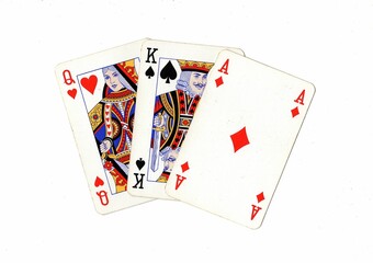 A hand of vintage playing cards isolated on a white background.