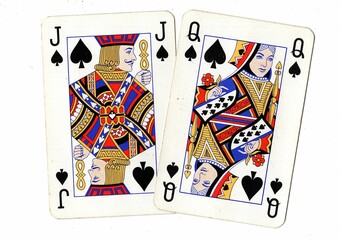 A blackjack or pontoon hand of vintage playing cards isolated on a white background.