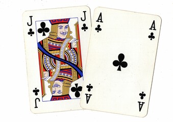 A blackjack or pontoon hand of vintage playing cards isolated on a white background.