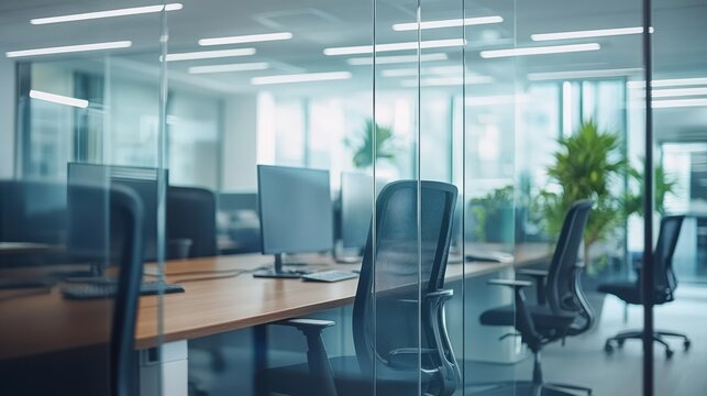 A modern office desk features numerous computers arranged efficiently, showcasing a workspace designed for productivity and technology integration.