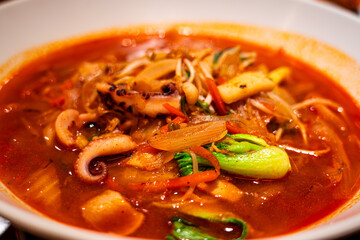 Jjamppong is a Korean noodle soup with red, spicy seafood
